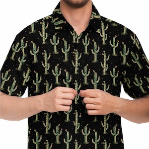 May include: A black short-sleeved button-down shirt with a repeating pattern of green cacti on a black background.