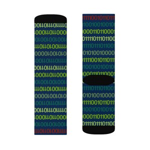 May include: A pair of blue socks with a pattern of binary code in red, green, and yellow.