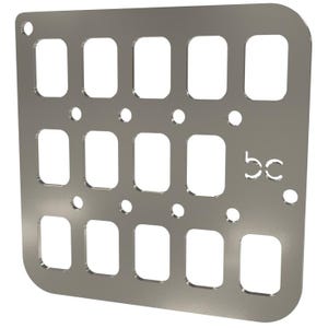 May include: A silver metal plate with a grid of 12 rectangular cutouts and 18 small round holes. The plate has a rounded corner and the letters "bc" in the lower right corner.
