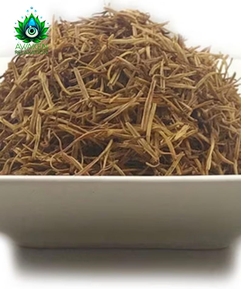 May include: A square white bowl filled with a mound of dried, thin, light brown herbal stems. In the upper left corner, a logo features a green lotus flower with a central eye and the text AWAKEN RELAXATION printed in green capital letters.