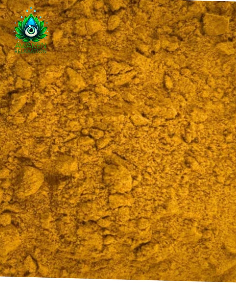 May include: Close-up of a pile of bright yellow turmeric powder.