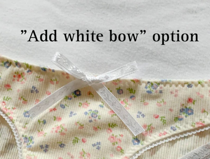May include: A white bow with a floral print on a white background. The text "Add white bow" option is visible above the bow.