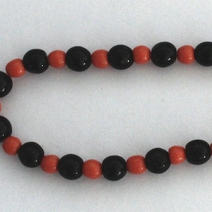 A single strand of Vintage Czechoslovakian Glass Mardi Gras beads.