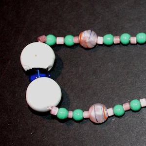 A single strand of Vintage (1920&#39;s / 1930&#39;s Czechoslovakian Glass Mardi Gras beads