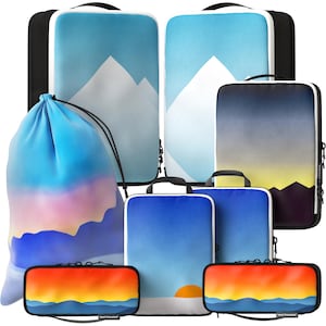 May include: A collection of travel bags and cases with landscape designs. The bags include a drawstring bag, laptop cases, and small zippered cases. The color palette features blues, oranges, and white, with mountain and sunset graphics. The cases have black and white trim.