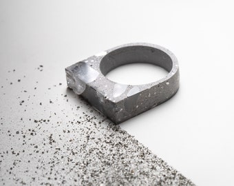 Brutalist grey concrete statement ring with crystal gemstone