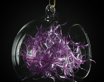 Glass Bauble filled with recovered plastic