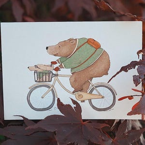 Postal *Radelraudis*. Perro. Oso. Bicicleta. Bici. Amistad animal. Rápido. Cumpleaños infantil. Paseo en bicicleta. Excursión. En marcha.