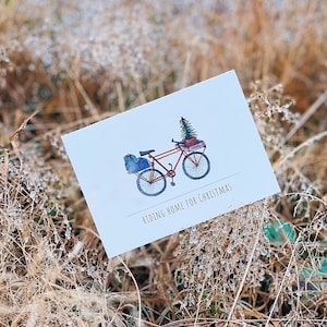 Carte de voeux "Rentrer à la maison pour Noël". Noël . Vélo . Climat. Monter. roue. Vacances. Pour l'environnement. Vélo