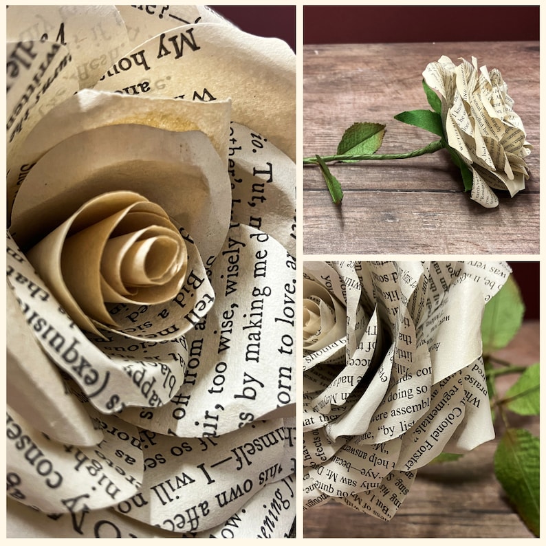 May include: A close-up of a white paper rose crafted from the pages of a book. The rose is constructed with multiple layers of paper, and the text from the book is visible on the petals. The rose is resting on a wooden surface.