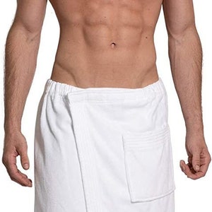 May include: A white terry towelling wrap featuring an elasticated waistband, a secure front overlap fastening, and a single patch pocket on the right side. The fabric has a textured, absorbent surface consistent with standard bath linens.