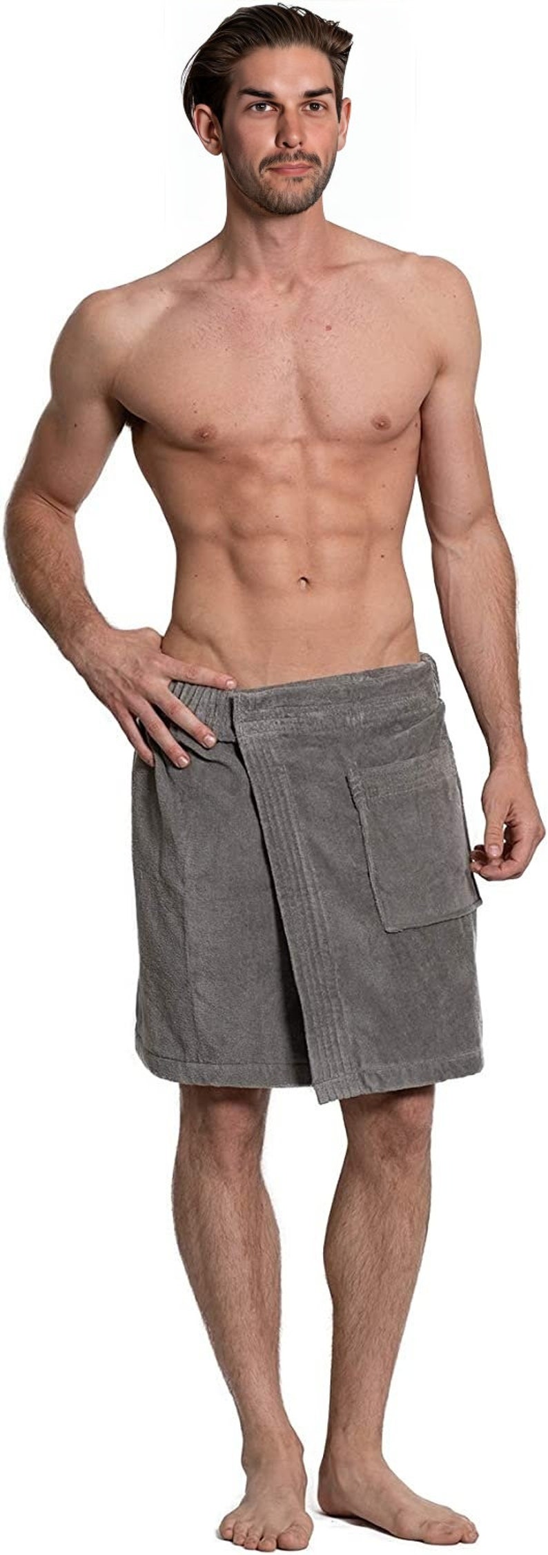 May include: A grey terry cloth wrap towel featuring an elasticated waistband, a secure front closure, and a single patch pocket on the right side. The fabric has a textured, absorbent surface and falls to just above the knee in length.