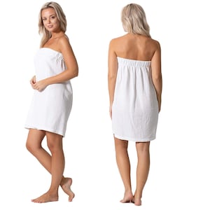 May include: A white strapless wrap dress made of a soft, textured fabric. The dress is shown on a model from the front and back.