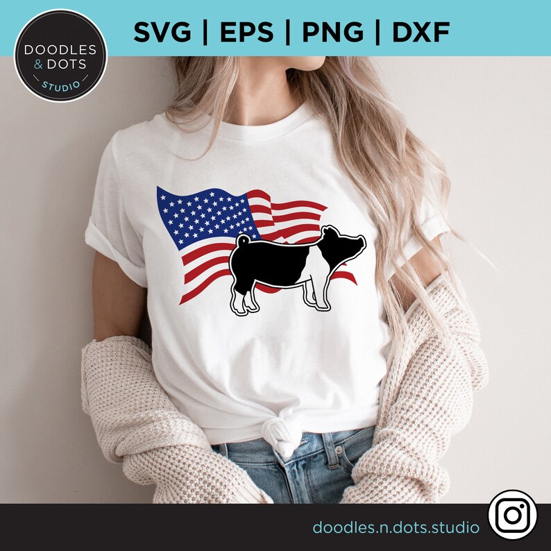 May include: A white t-shirt with a black and white pig silhouette in front of an American flag. The flag is red, white, and blue.
