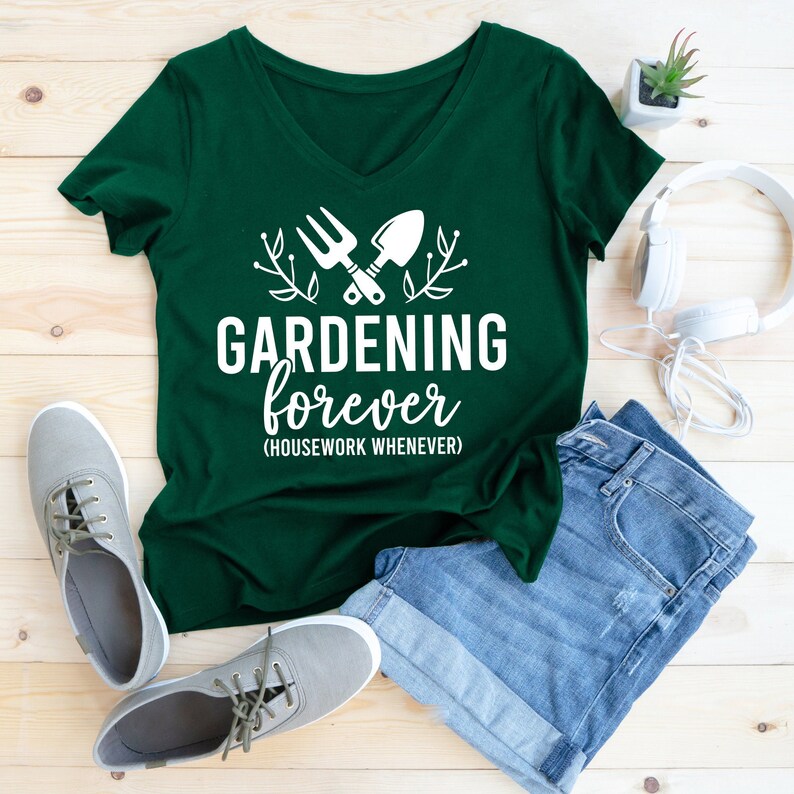 May include: A green t-shirt with a white graphic of gardening tools and the text "GARDENING forever (HOUSEWORK WHENEVER)".