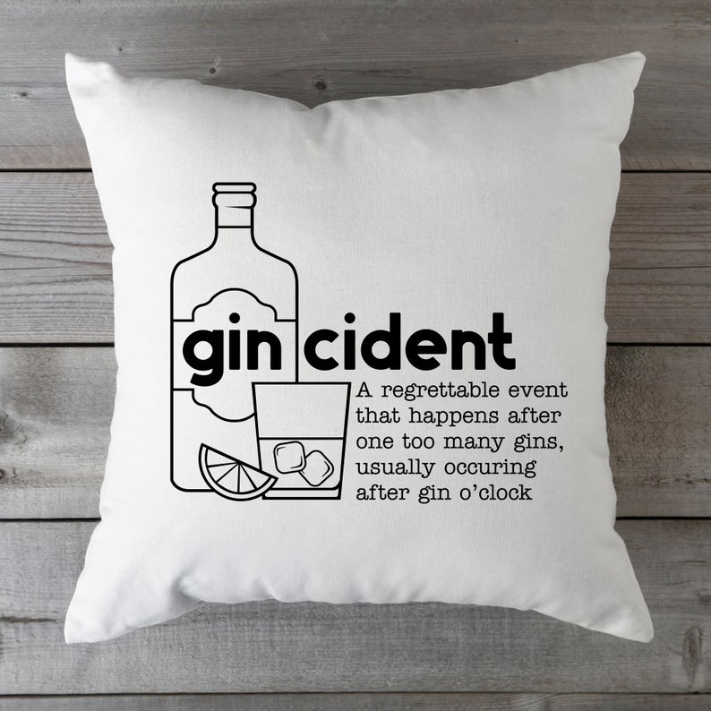 May include: White throw pillow with black text and a graphic of a bottle of gin and a glass of gin with ice and a lime wedge. The text reads "gin cident" and "A regrettable event that happens after one too many gins, usually occurring after gin o'clock."