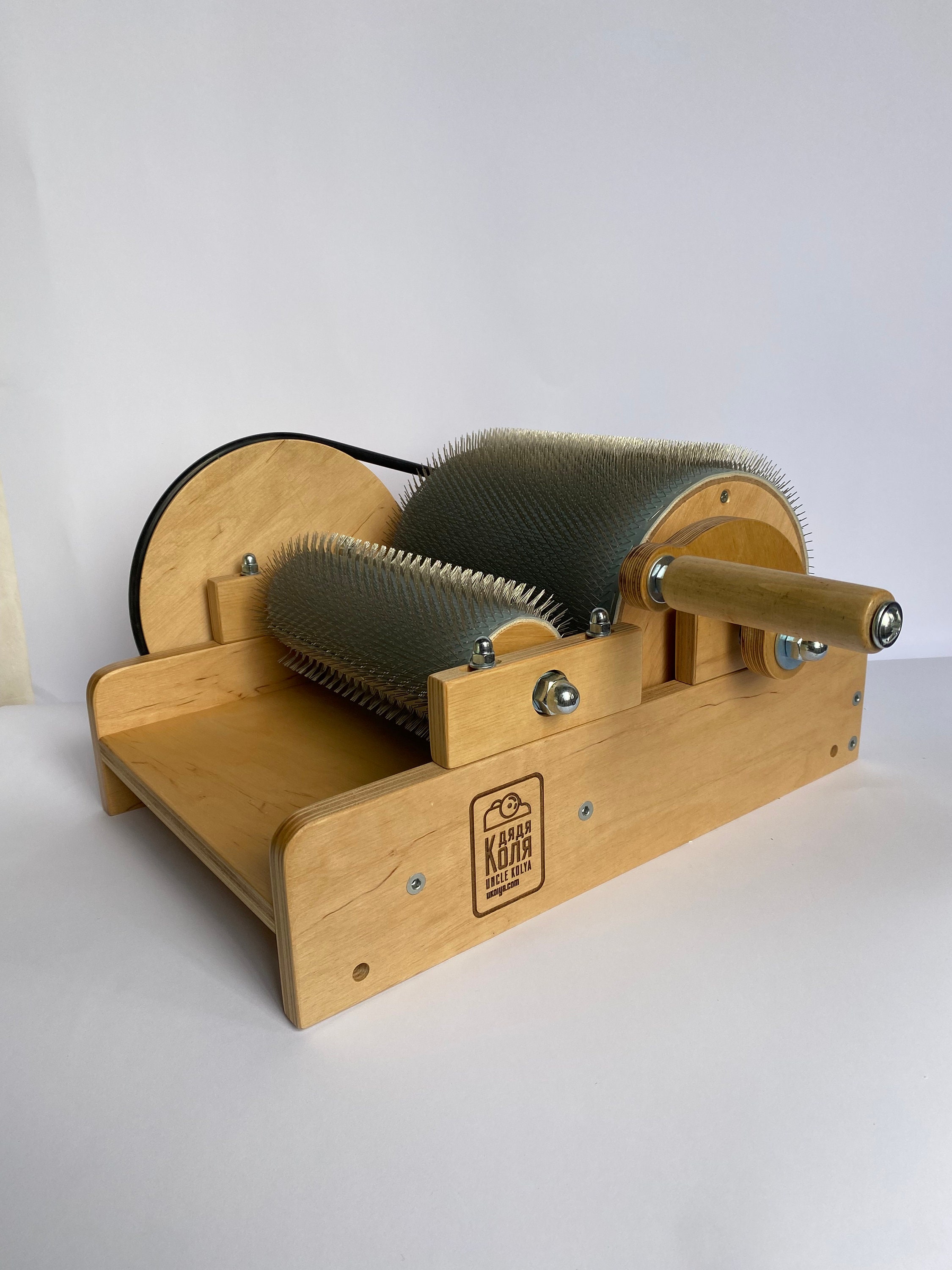 Does anyone know what company/drum carder this is? I recently got this  exact model from my local textile museum as an antique and I can't figure  it out. Any help would be