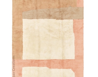 Könnte beinhalten: Ein geometrischer Teppich in Beige und Pfirsich mit Fransenbordüre. Der Teppich hat ein modernes Design mit einem großen Rechteck in der Mitte und kleineren Rechtecken darum herum.