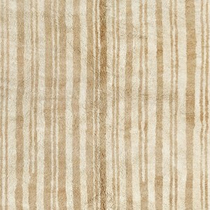 May include: A beige rug with vertical stripes of a slightly darker beige color.
