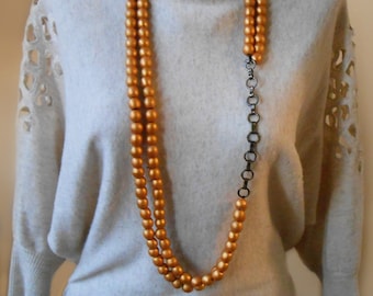 Long goldish wood bead necklace for women. Layering jewelry with chain