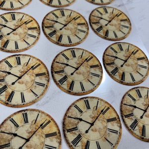 May include: Twelve round, vintage-style clock face stickers with Roman numeral markings and a distressed, aged look. The clock faces feature a world map design in the background.