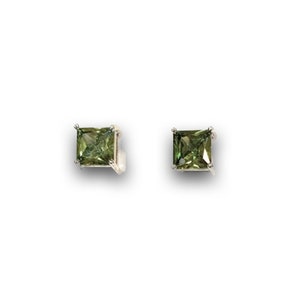 May include: A pair of silver stud earrings with square green gemstones.
