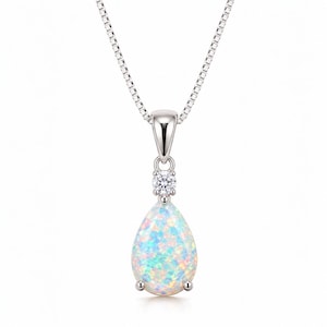May include: A silver-toned necklace featuring a pear-shaped opal pendant with iridescent blue, green, and pink flashes. A small, round, clear faceted stone is set directly above the opal, connecting it to a delicate silver box chain.