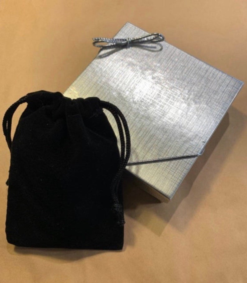 A silver foil box and bow are included making this a perfect gift for mom, daughter, wife or friend.