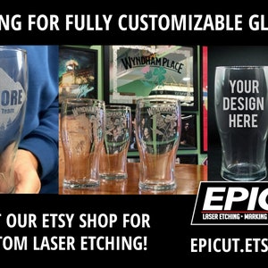May include: Three clear glass pint glasses with custom laser etching. The glasses are on a wooden table. The text on the glasses reads "WYNDHAM PLACE" and "YOUR DESIGN HERE". The text on the sign reads "EPICut LASER ETCHING MARKING ENGRAVING EPICUT.ETSY.COM".