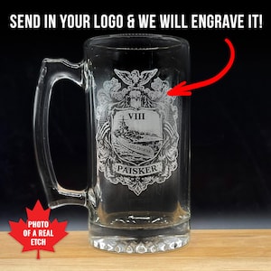 May include: A clear glass beer mug featuring a laser-engraved crest with an eagle, a ship labelled USS CROATAN, the Roman numeral VIII, and the name PAISKER. Text at the top reads SEND IN YOUR LOGO & WE WILL ENGRAVE IT! A red maple leaf icon says PHOTO OF A REAL ETCH.