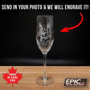 May include: A clear glass champagne flute with a laser-etched image of a cat's face. The text "SEND IN YOUR PHOTO & WE WILL ENGRAVE IT!" is at the top of the image. The text "PHOTO OF A REAL ETCH" is at the bottom of the image. The text "EPICut LASER ETCHING - MARKINGS - ENGRAVING" is at the bottom right of the image.
