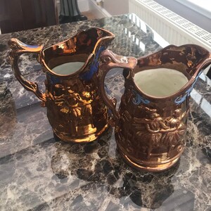 Two Large Victorian Copper Lustre Jugs