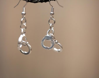 Silver handcuff dangle earrings