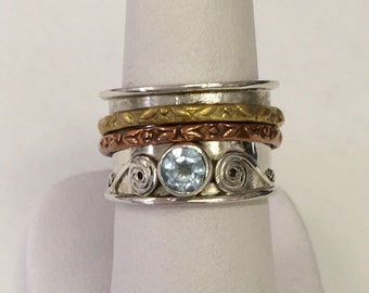 Sterling silver band ring with blue topaz