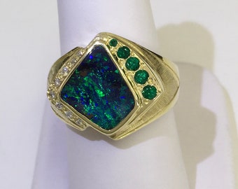 Boulder opal, emeralds and diamonds set in 18 kt green gold ring original design by Cindy