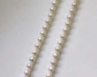 Fresh water pearl necklace with silver clasp round shape 21 1/2" length knotted