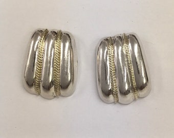 Sterling silver fashion stud earrings.