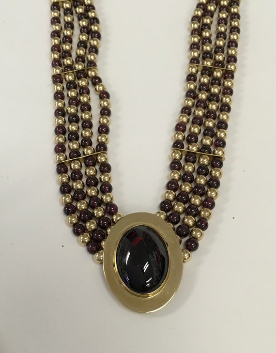 Necklace made of garnet and yellow gold beads with