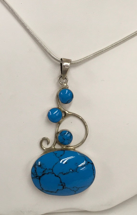 Turquoise and silver pendant
