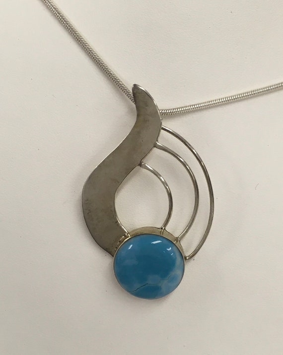 Sterling silver pendant with blue stone