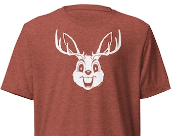 May include: A red heather t-shirt with a white cartoon deer head graphic. The deer has large antlers and a smiling face.