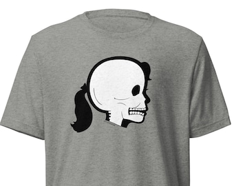 May include: A heather grey t-shirt with a black and white illustration of a skull with a ponytail.