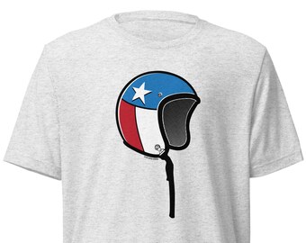 May include: A grey t-shirt with a graphic of a motorcycle helmet in the style of the Texas flag. The helmet is blue, white, and red with a single white star.