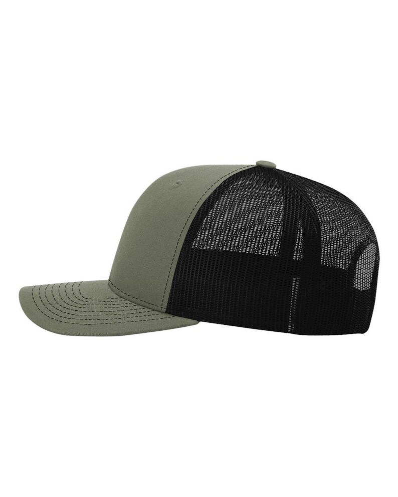 May include: Olive green and black trucker hat. The hat features a solid olive green front panel and bill, with a black mesh back. The bill has a curved design with stitched detailing. A small button is at the top of the hat.