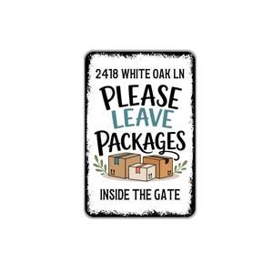 May include: A rectangular metal sign with a distressed black border. The sign reads "2418 WHITE OAK LN PLEASE LEAVE PACKAGES INSIDE THE GATE" in a mix of fonts and colors. Three illustrated cardboard boxes are at the bottom.