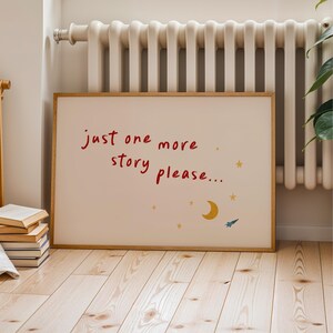 A framed poster with the text "Just one more story please..." and a small illustration of a crescent moon and a shooting star.