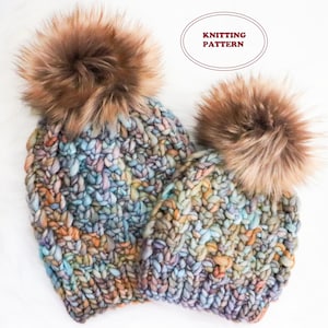 May include: Two chunky knit hats with faux fur pom-poms. The hats are in shades of blue, purple, and orange. The text "KNITTING PATTERN" is in a red oval. The hats are on a white background.