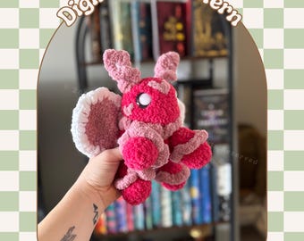 Peut inclure: Un modèle de crochet pour un amigurumi en forme de coccinelle rose et blanche. Le modèle s'appelle "Lola the Love Bug" et est disponible en téléchargement numérique PDF.