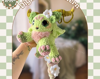May include: A crochet pattern for Taurus the Zodiac Spirit, a green and pink amigurumi with a flower crown and a long tail. The pattern is available as a digital PDF download.