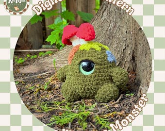 May include: A crocheted moss monster with a large, reflective eye and a mushroom cap. The monster is green with patches of color and the text "lil' Moss Monster". The image also includes the text "Digital PDF Pattern".